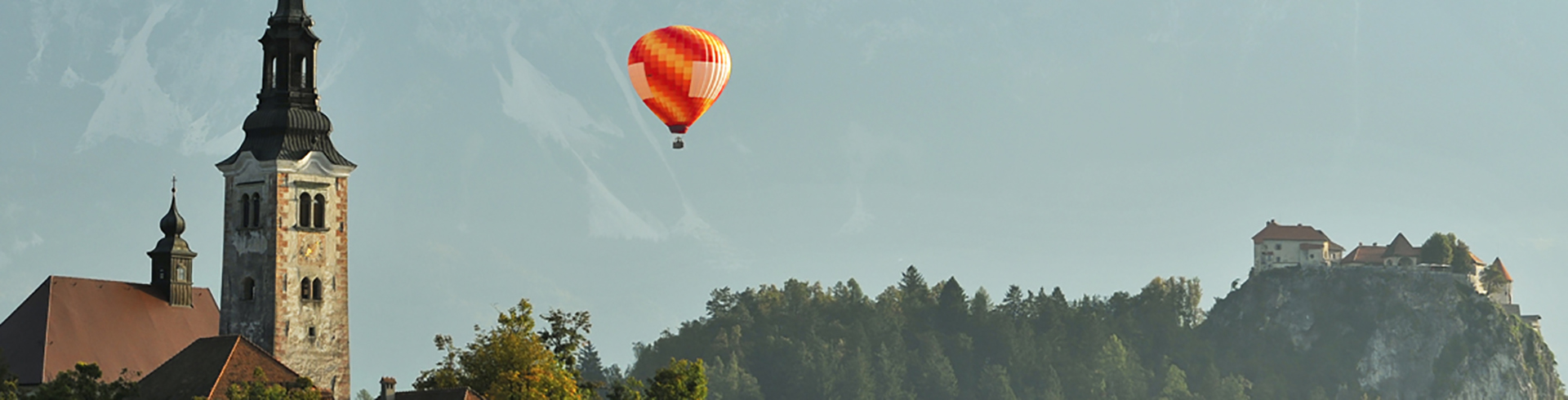 Hot air ballooning over Lake Bled and castle
